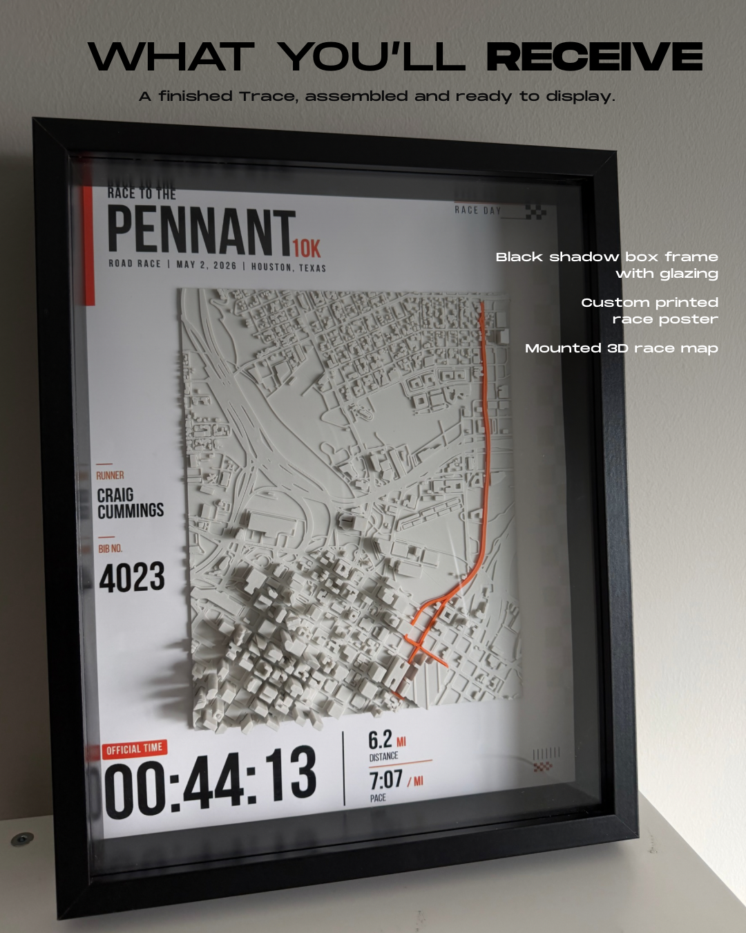 Assembled Trace with black glazed shadow-box frame, custom race poster and mounted 3D race map.